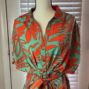 Super cute orange and green/blue button down dress. Used.